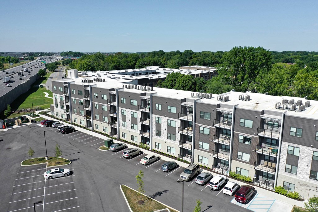 an aerial view of an apartment building overlooking a parking lot at SouthPointe Village Apartments, LP, Fishers