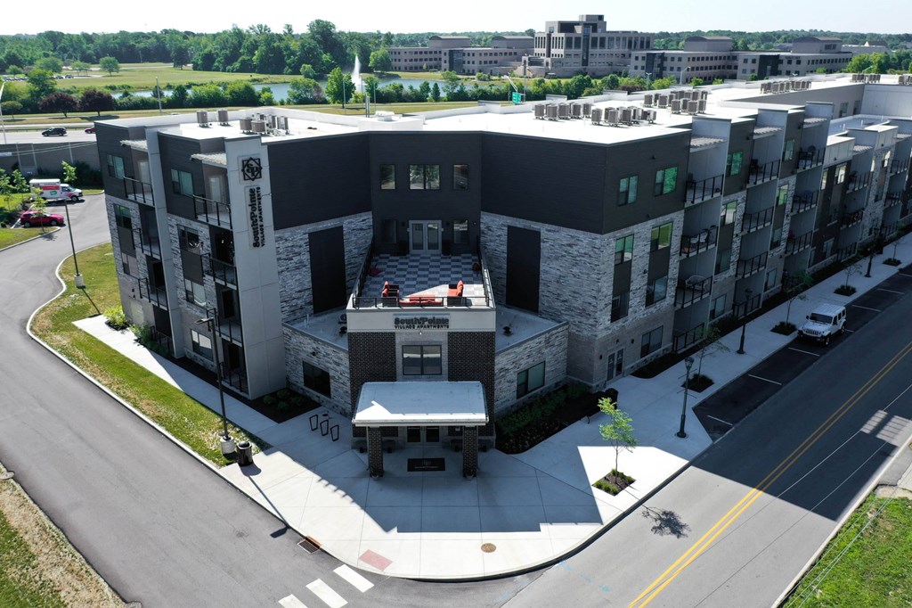 an aerial view of a large building with a parking lot at SouthPointe Village Apartments, LP, Indiana