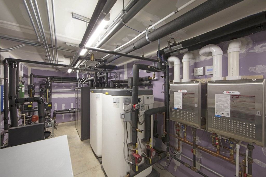 a room filled with lots of pipes and machines