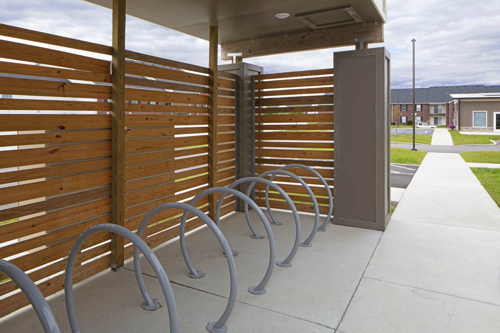 a row of bike racks outside of a building