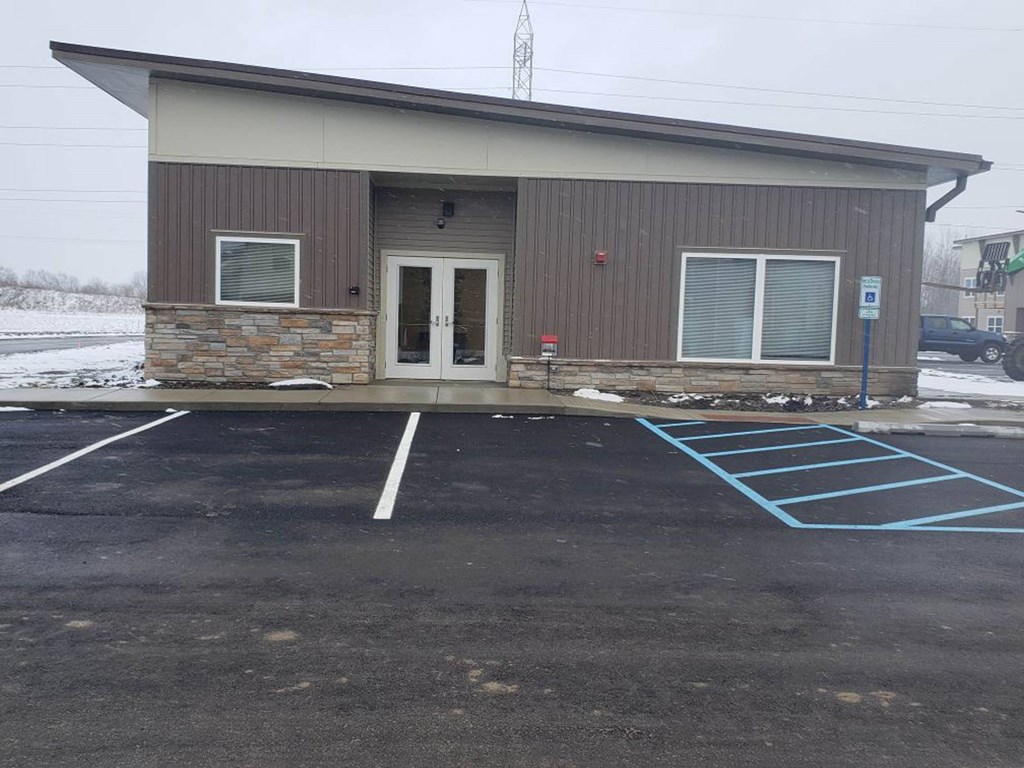 an empty parking lot in front of a building