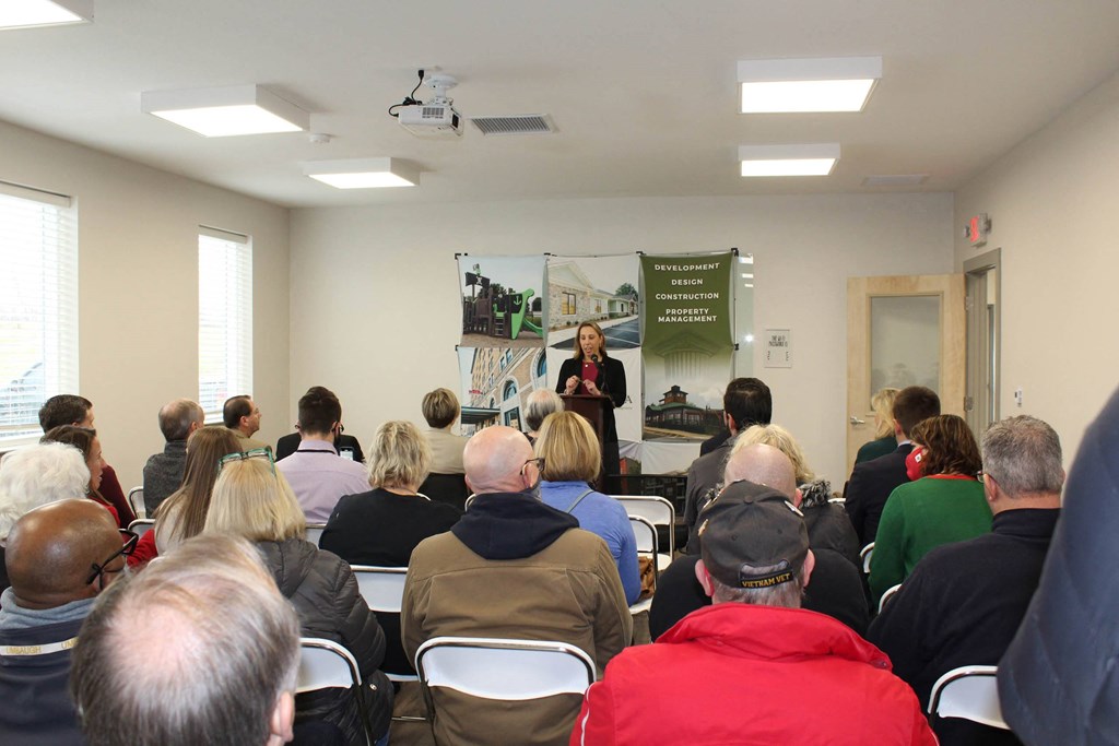 a group of people watching a presentation in a room  at Haven Homes Apartments, LP, Plainfield, Indiana