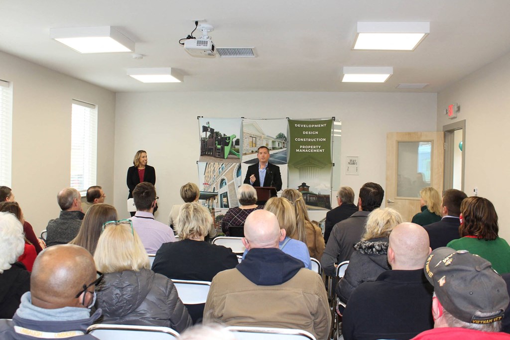 a group of people watching a presentation in front of a crowd  at Haven Homes Apartments, LP, Indiana