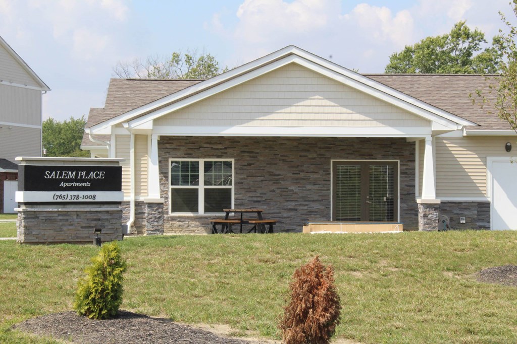 the front of a house with a picnic table on the lawn at Salem Place Apartments, Daleville, 47334