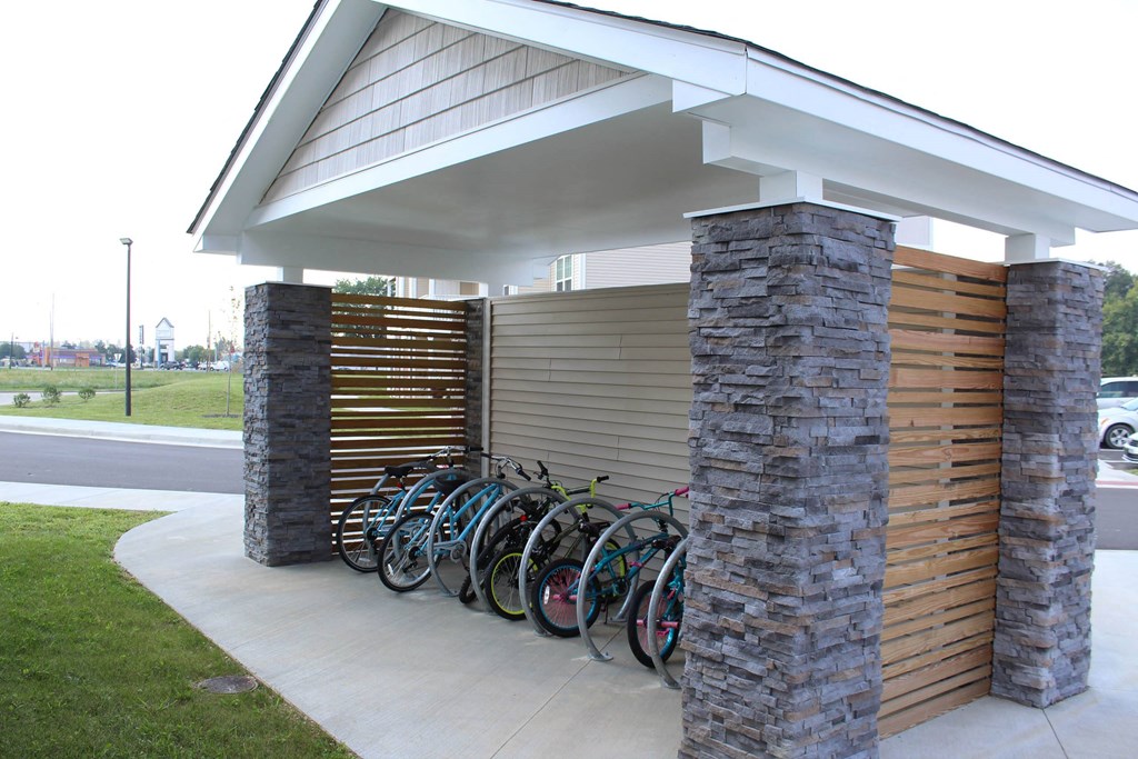 a row of bikes parked outside of a building at Salem Place Apartments, Daleville, Indiana