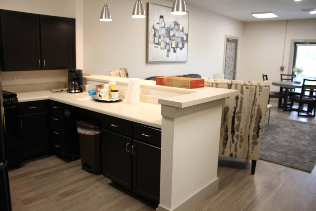 a view of a kitchen and dining area in a home at Salem Place Apartments, Daleville, IN