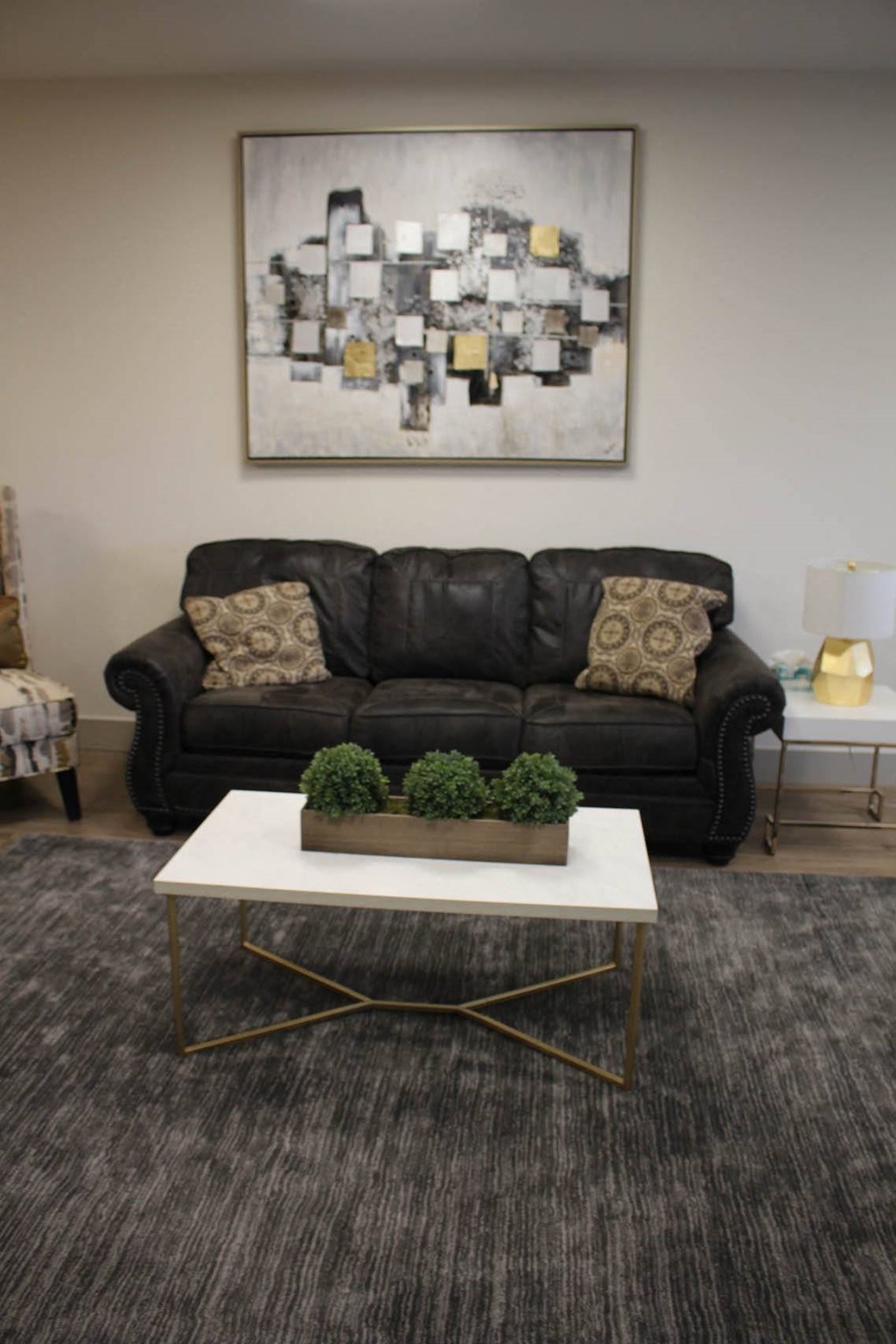 a living room with a couch and a coffee table at Salem Place Apartments, Daleville, Indiana