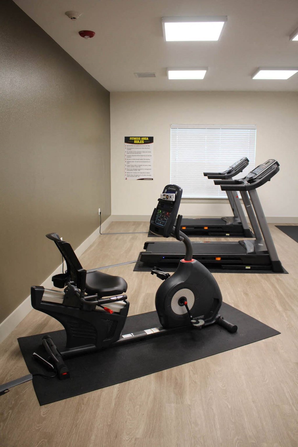 a gym with an exercise bike and other equipment in a room at Salem Place Apartments, Daleville, IN, 47334