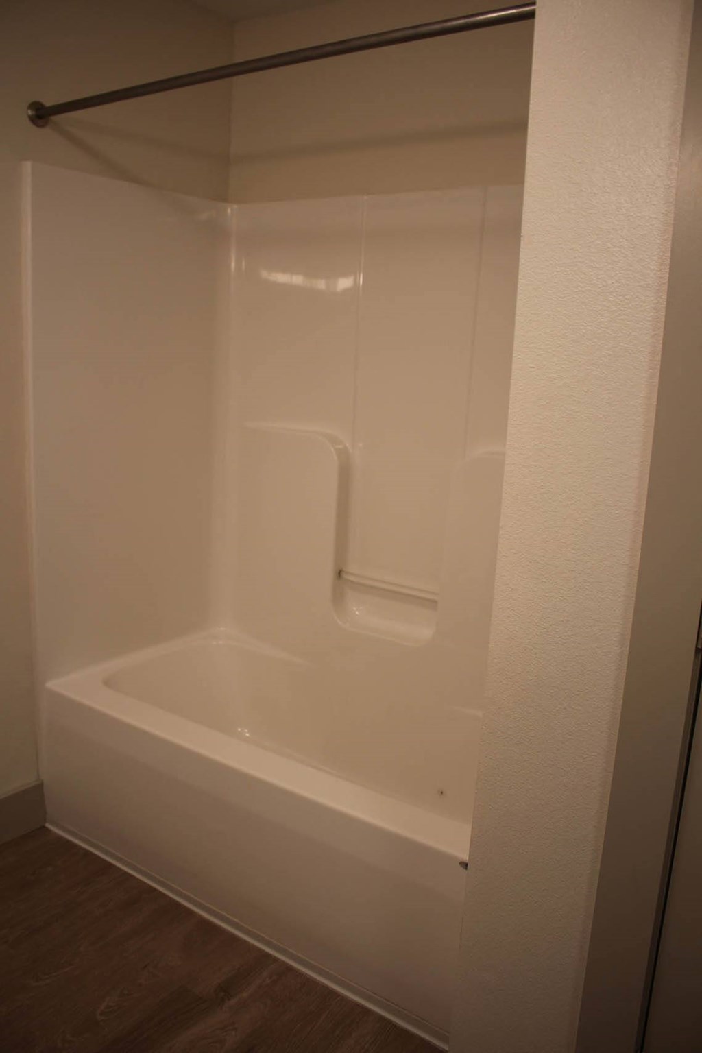 a shower stall in a bathroom with white walls at Salem Place Apartments, Daleville, IN, 47334