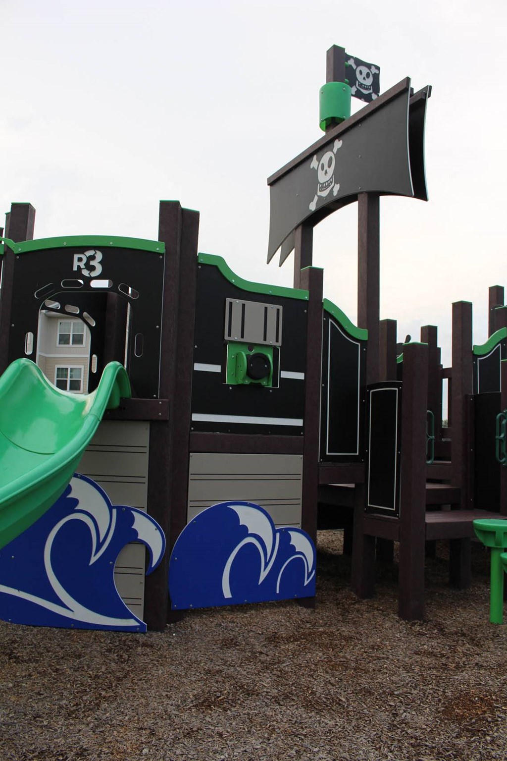 a playground with a playset and a parking meter at Salem Place Apartments, Indiana