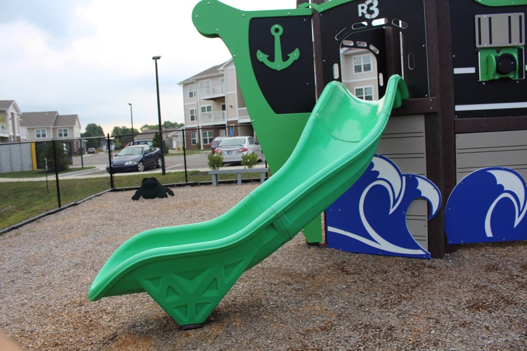 a slide at a playground at a park at Salem Place Apartments, Daleville, Indiana
