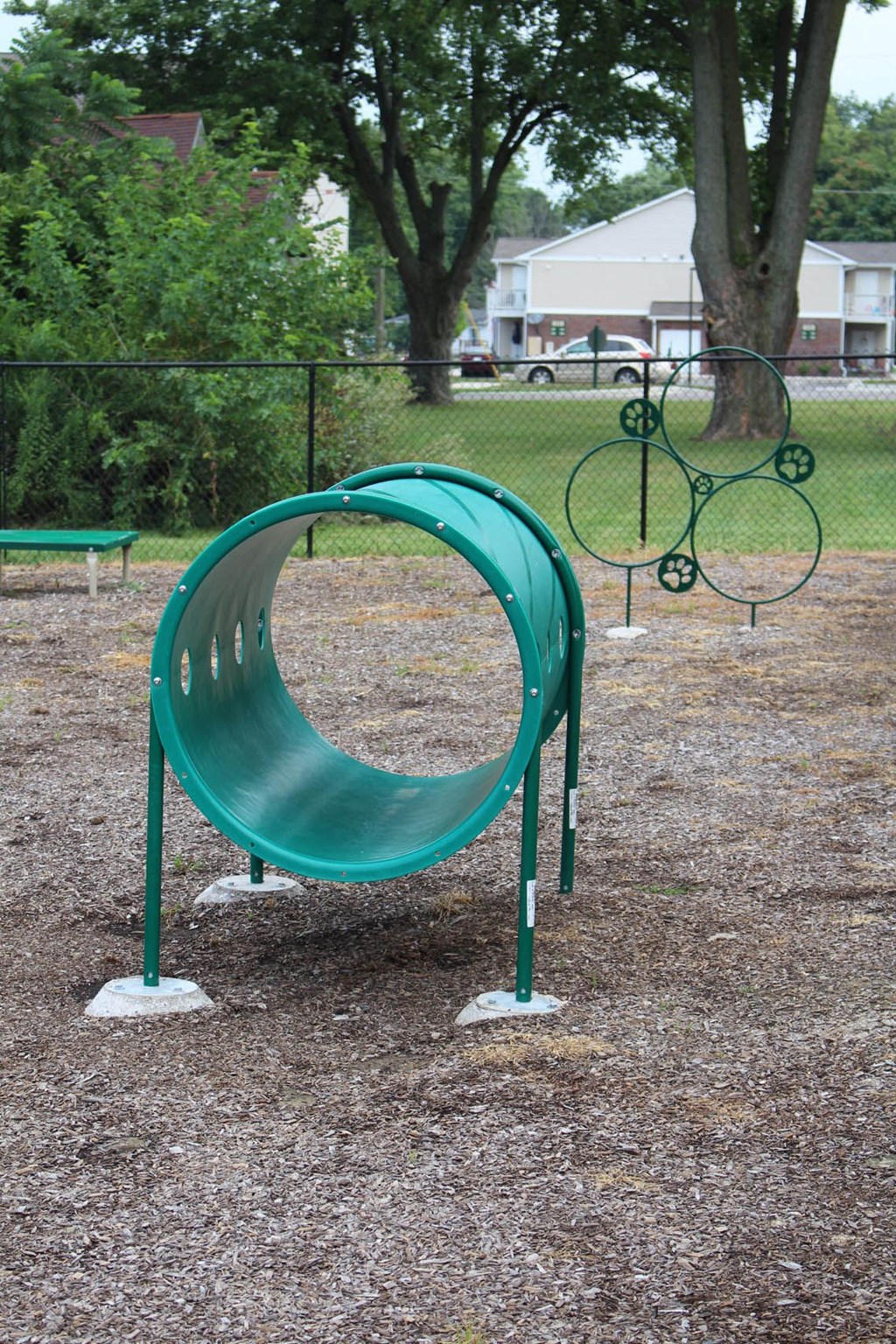 a green swing set in a park at Salem Place Apartments, Daleville, IN