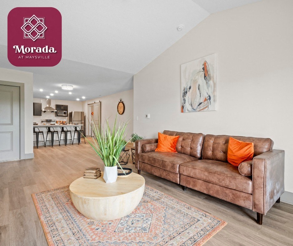 a living room with a couch and a coffee table at Morada at Maysville, Fort Wayne, IN, 46815