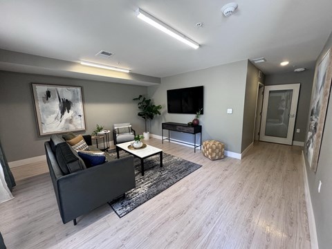 a living room with a couch and a tv  at MountainView Flats, Glenwood Springs, CO, 81601