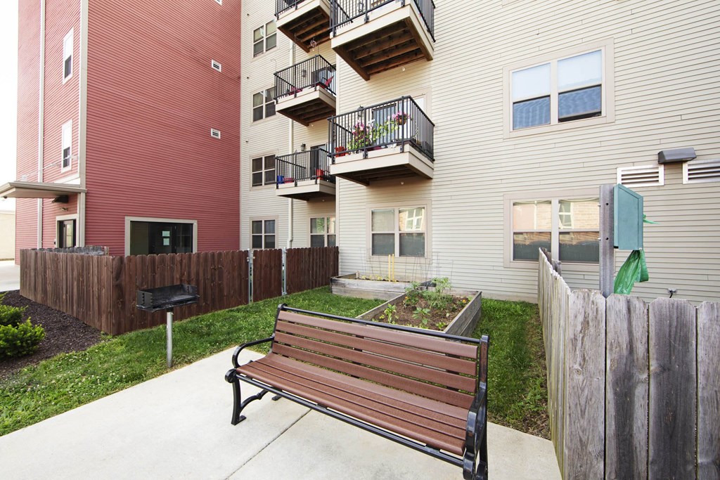 a park bench in front of some apartment buildings  at North Harrison Senior Apts, Indiana