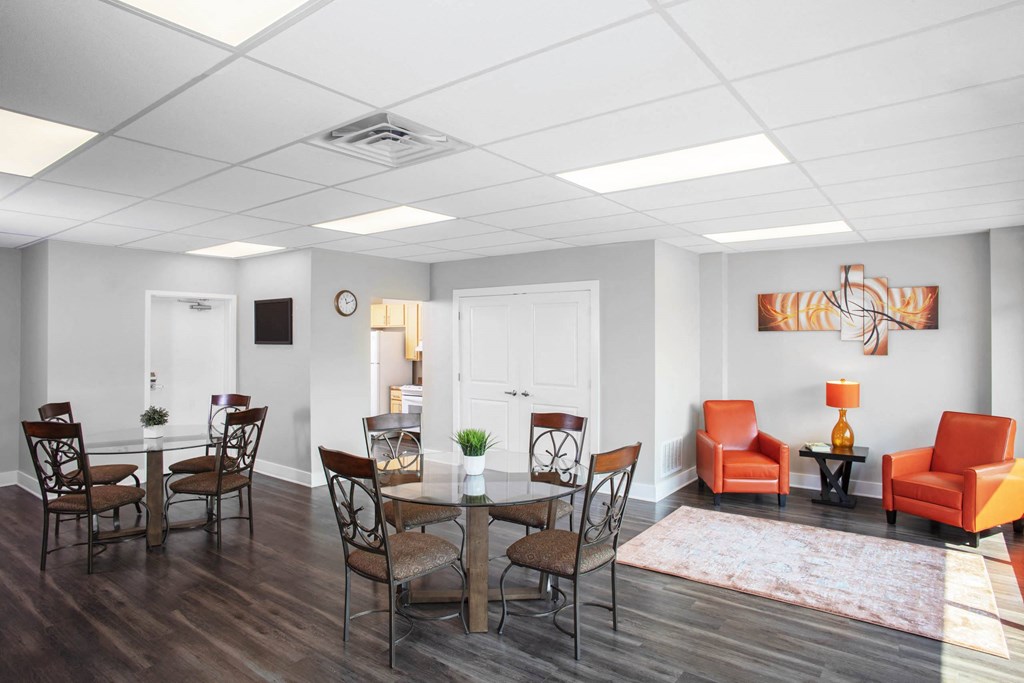 a living room with a dining room table and chairs  at North Harrison Senior Apts, Shelbyville, IN, 46176
