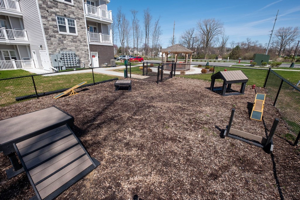 a playground at the residences at the estates woodland park apartments at Ritchey Reserve, Fishers, IN