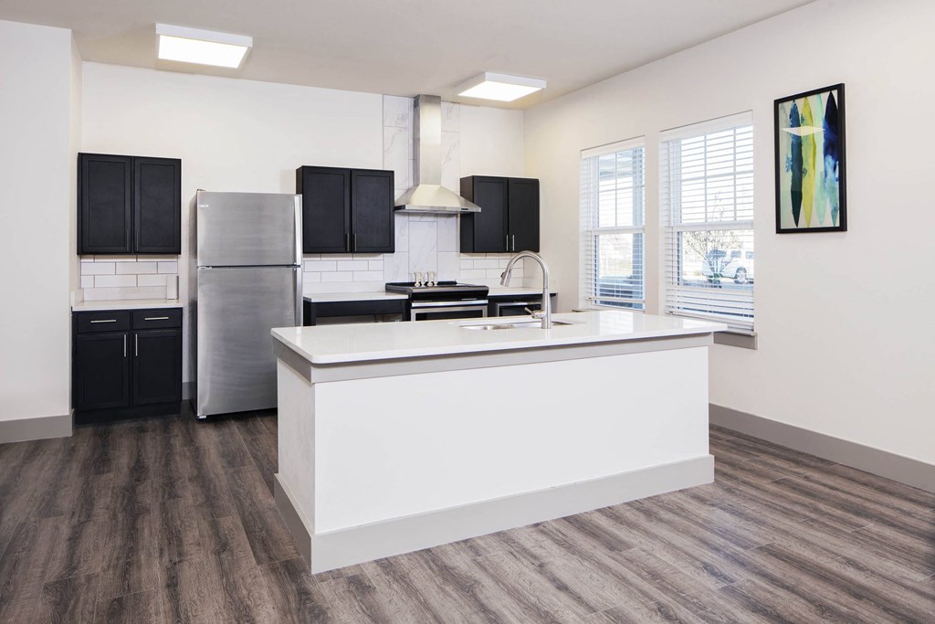 a kitchen with a large island and a stainless steel refrigerator at Ritchey Reserve, Indiana