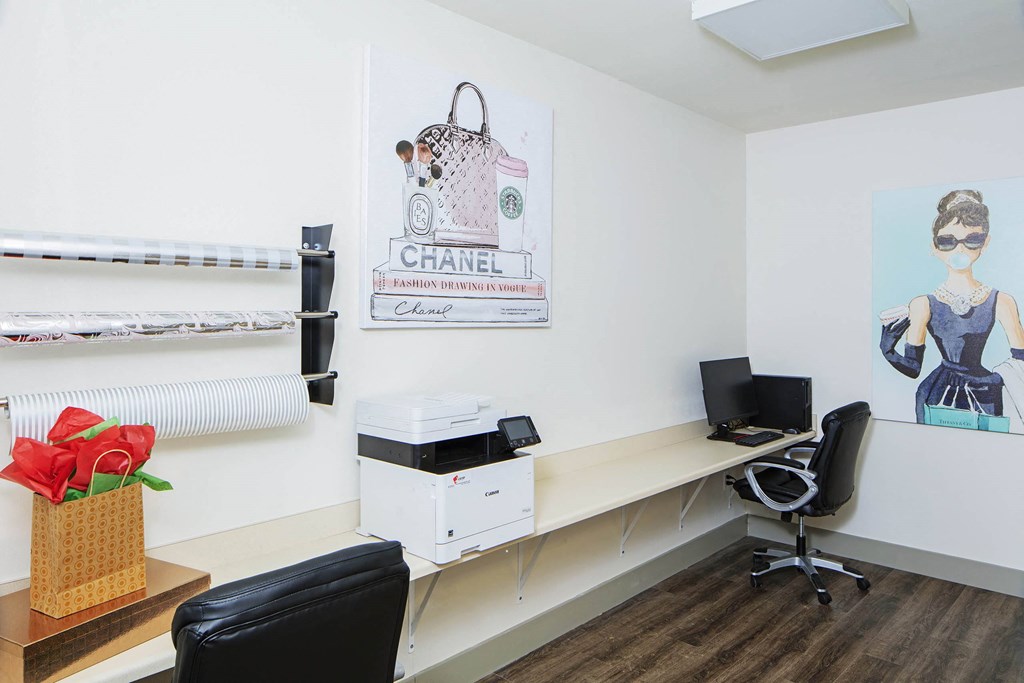 an office with a desk and a printer and a poster on the wall at Ritchey Reserve, Fishers, 46038