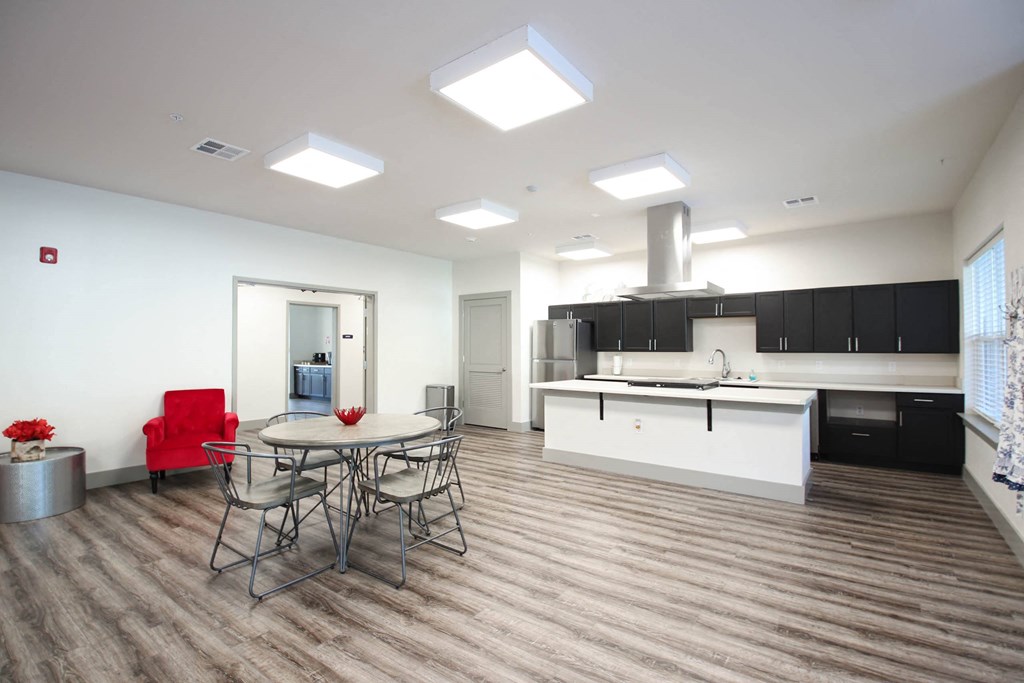 a kitchen and dining room with a table and chairs at SouthPointe Village Apartments, LP, Fishers, 46038