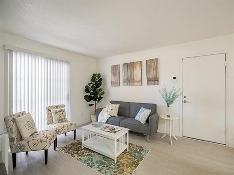 a living room with a couch and a table