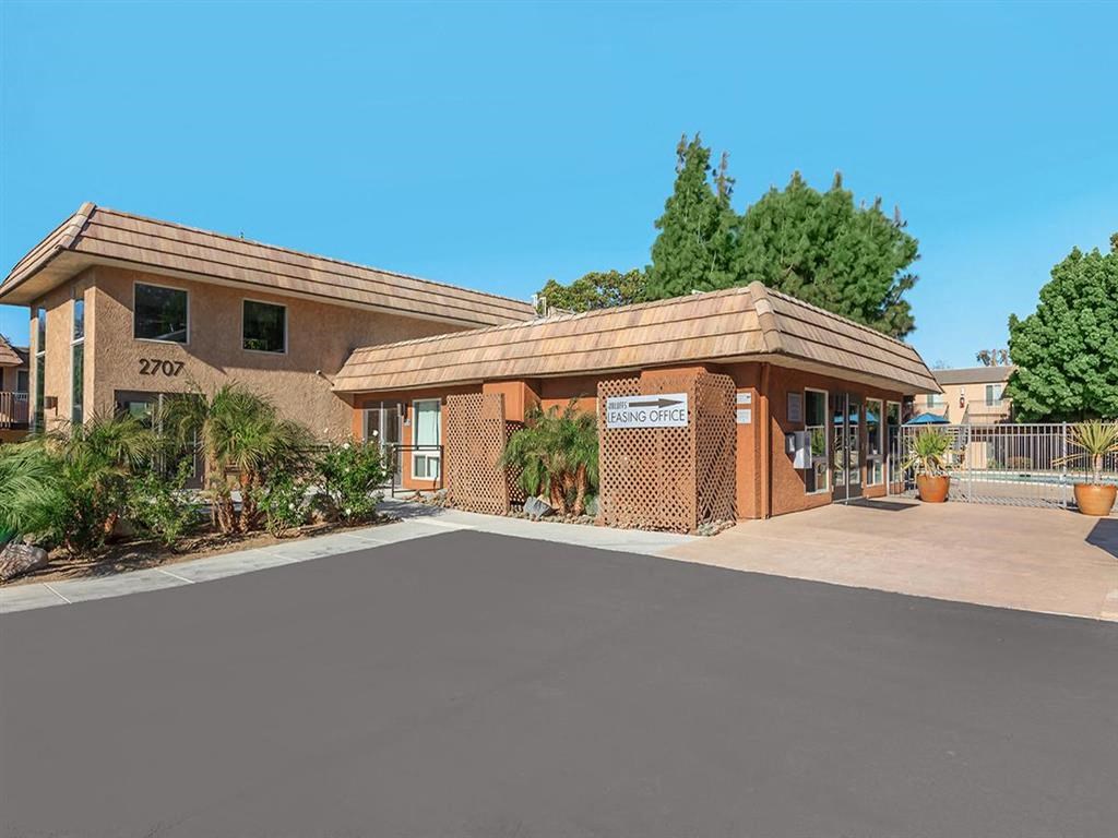 a building with a parking lot in front of it