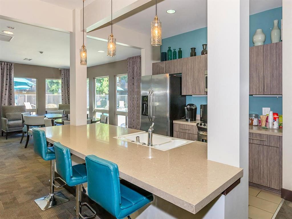 a kitchen with a counter top and a sink