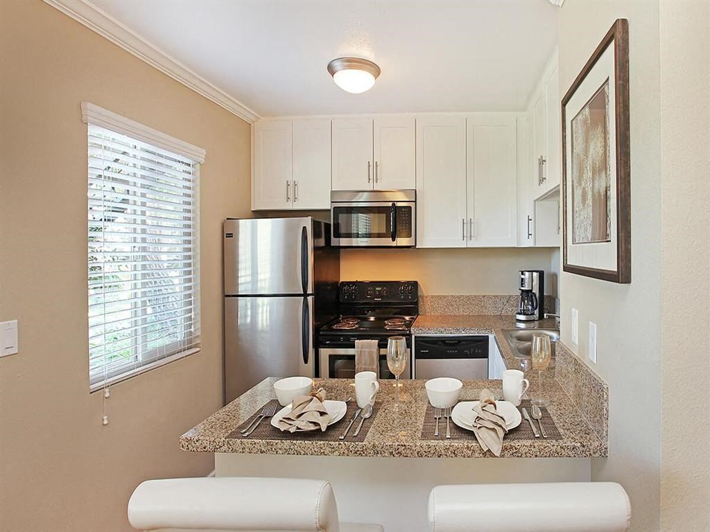 a kitchen with a granite counter top