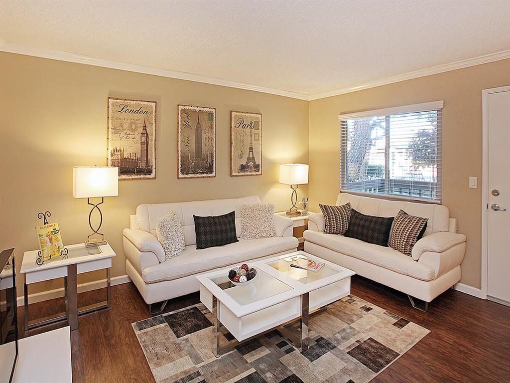 a living room with two couches and a table