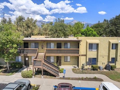 Apartment building with a mountain in the background.