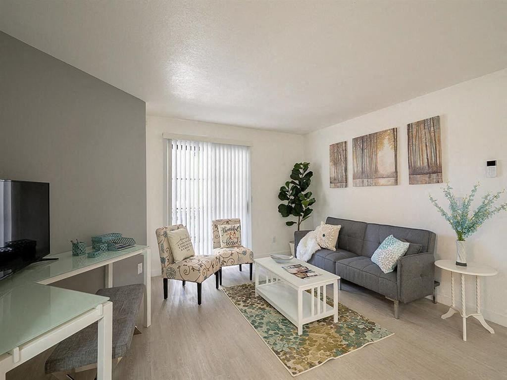 a living room with a couch and a table