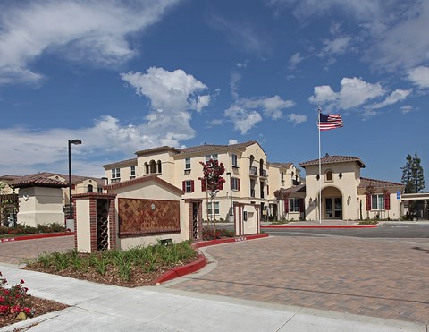 A building with a flag on top and a sign on the front.