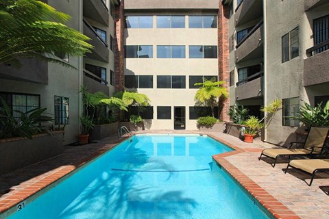 a swimming pool in the middle of an apartment building