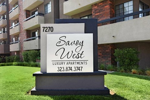 an apartment building with a sign that says luxury apartments