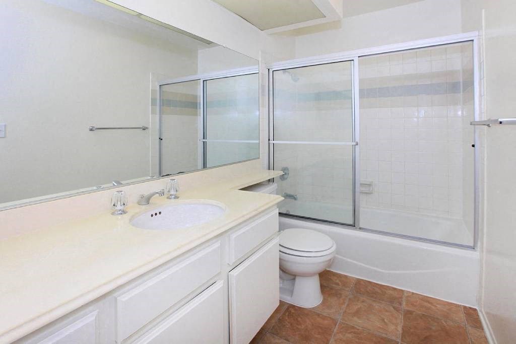 a bathroom with a sink toilet and a shower