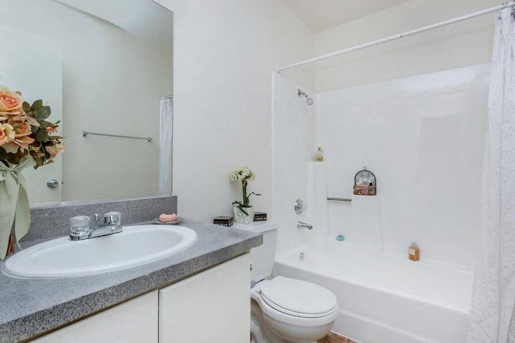 a bathroom with a sink toilet and a shower