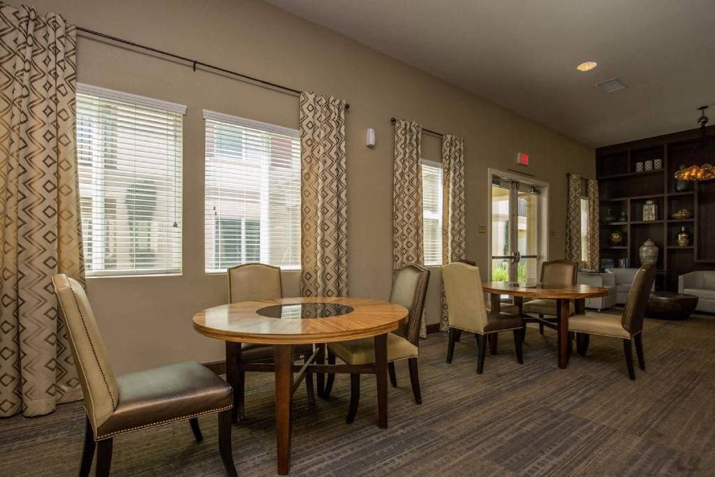 a dining room with a table and chairs
