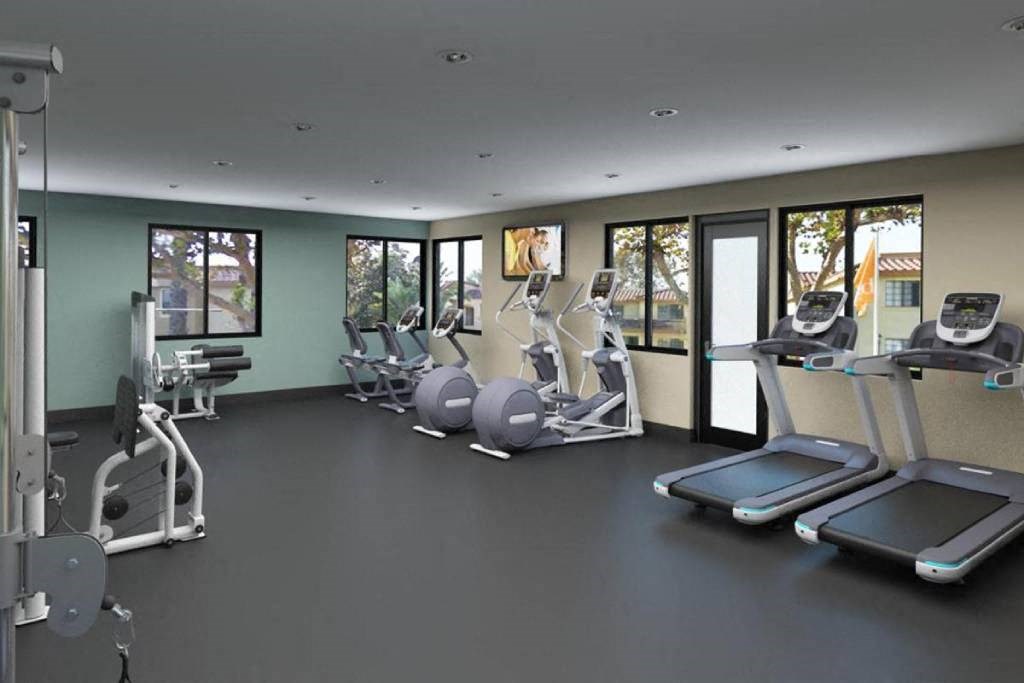the gym in the lobby of the apartments