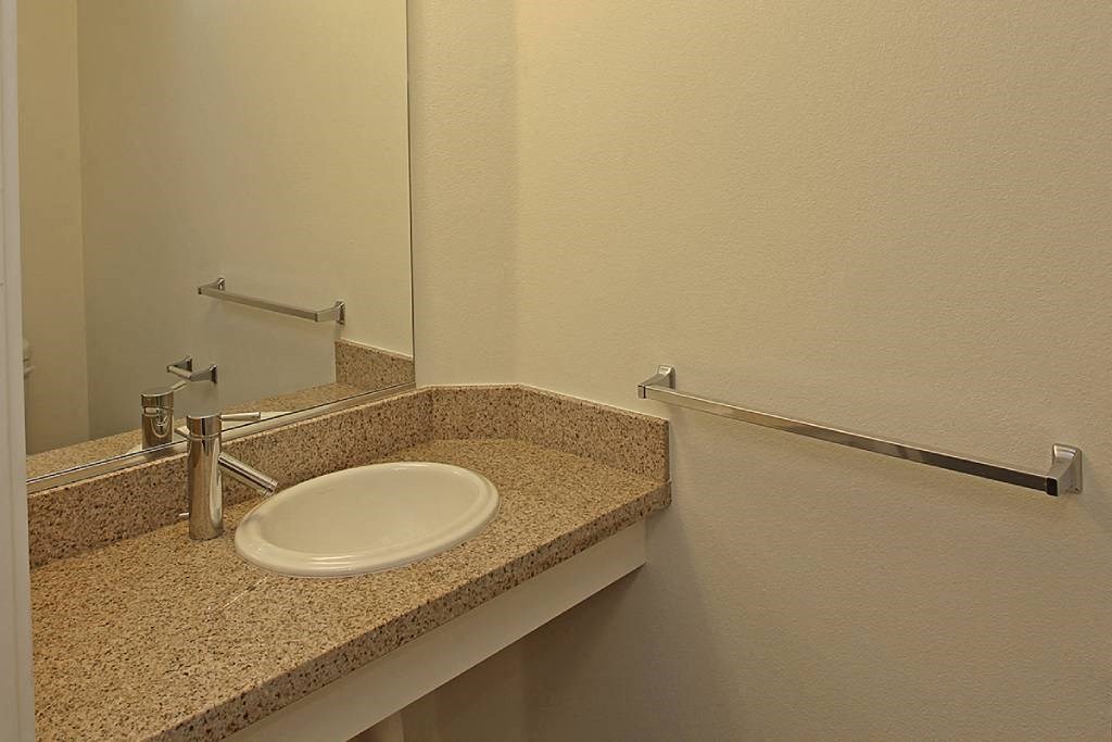 a bathroom with a sink and a mirror