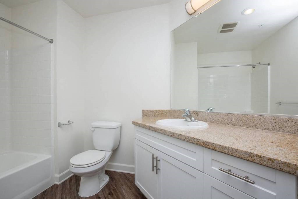 a bathroom with a sink toilet and a shower