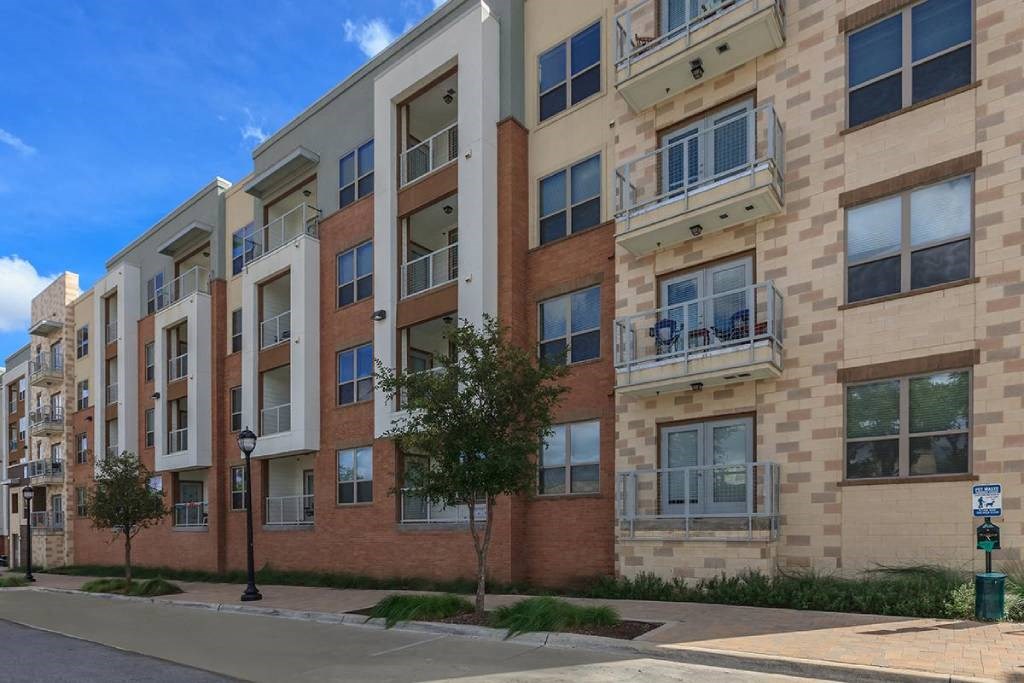 an apartment building on the corner of a street
