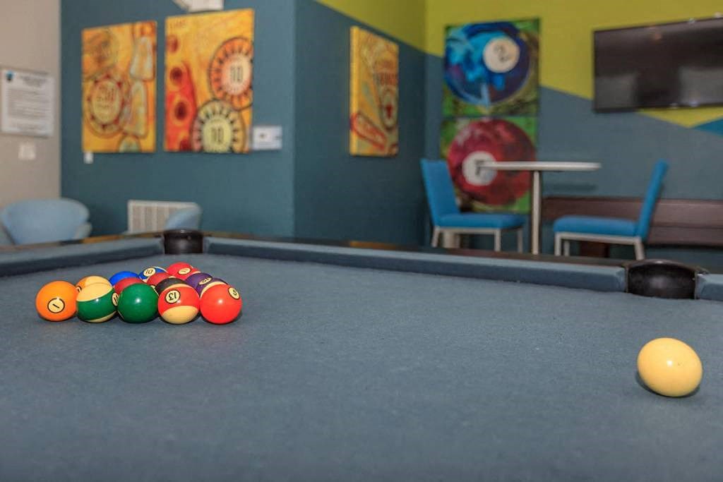 a pool table with a bunch of balls on it