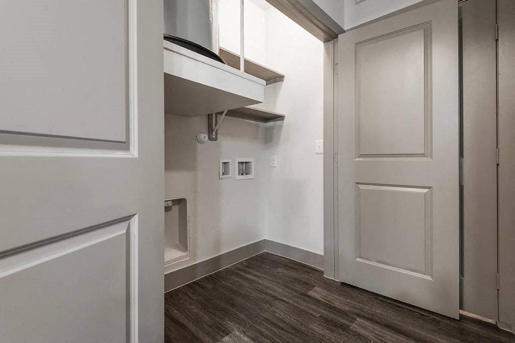 a white room with a white door and a white closet