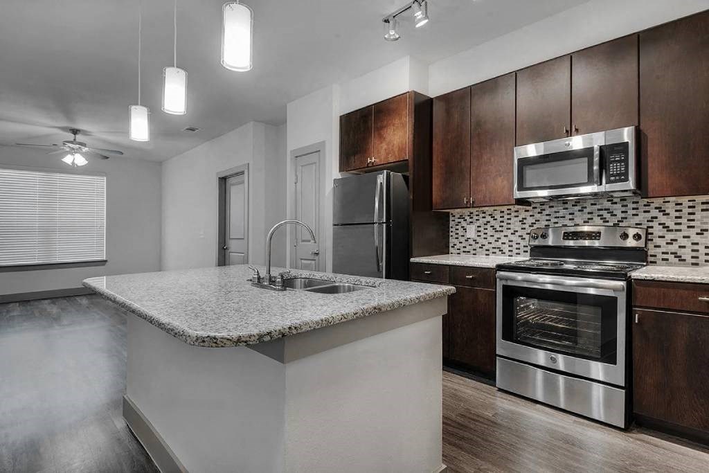 a kitchen with a counter top and a sink