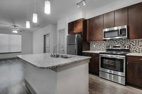 a kitchen with a counter top and a sink