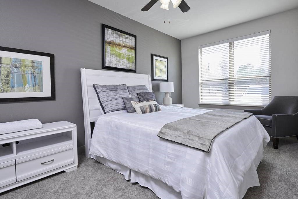 a bedroom with a bed and a closet