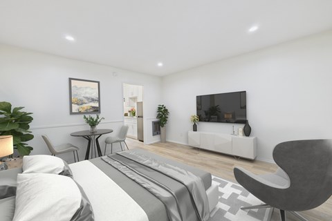 A modern bedroom with a large bed and a television.