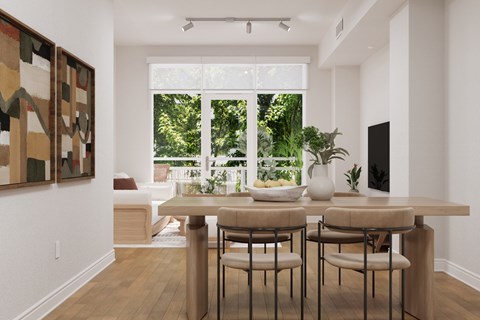 A dining room with a table and chairs and a painting on the wall.