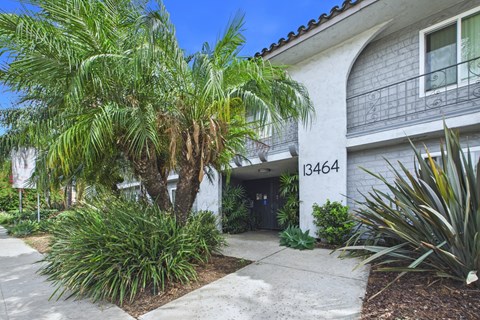 A white building with the number 13464 on it.