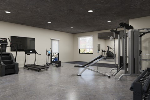 A spacious home gym with a variety of equipment.